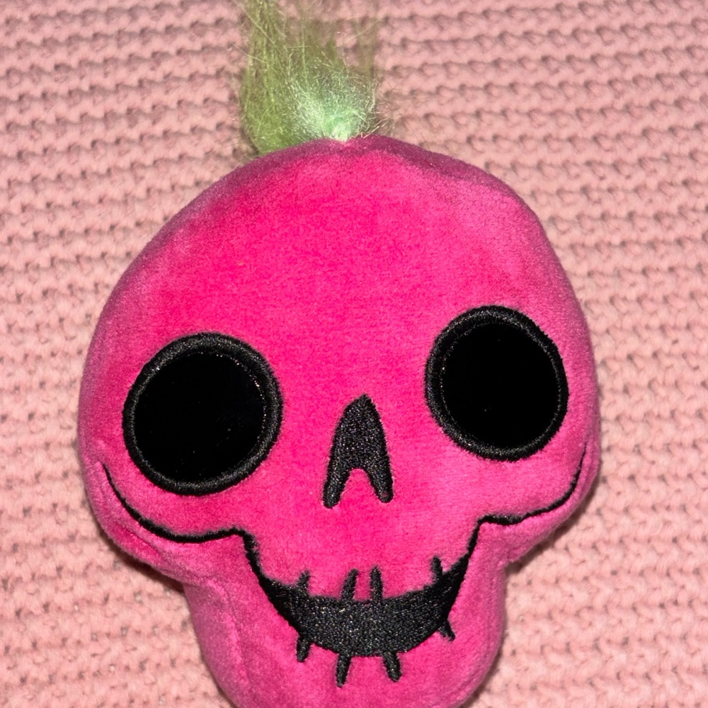 Pink Plush Skull Toy with Green Hair
